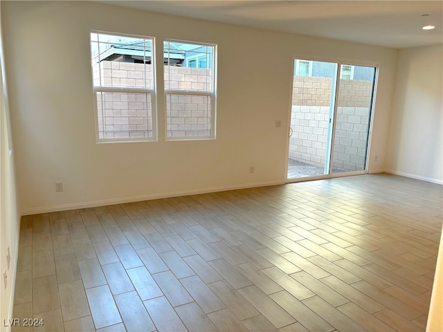 spare room featuring light wood-type flooring