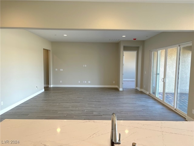 spare room featuring dark hardwood / wood-style flooring