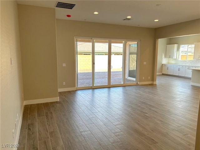 unfurnished room featuring light wood-type flooring