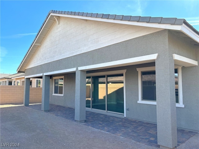 rear view of house featuring a patio area