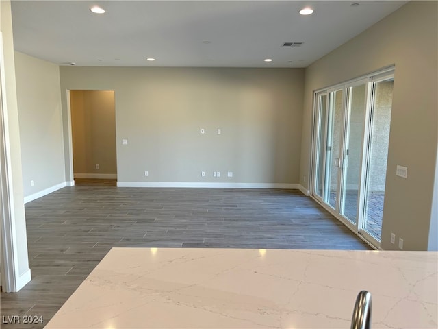 spare room featuring dark hardwood / wood-style flooring