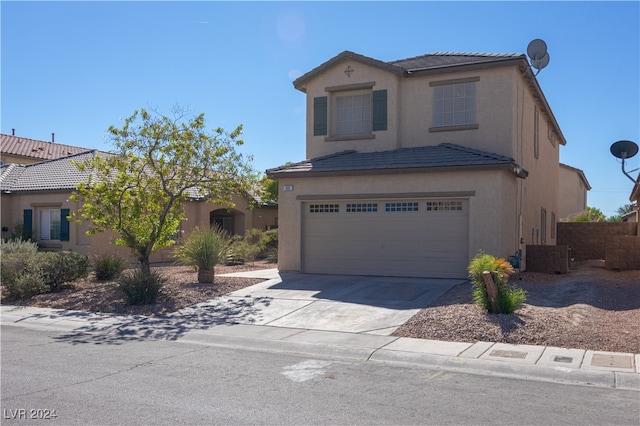 front of property with a garage