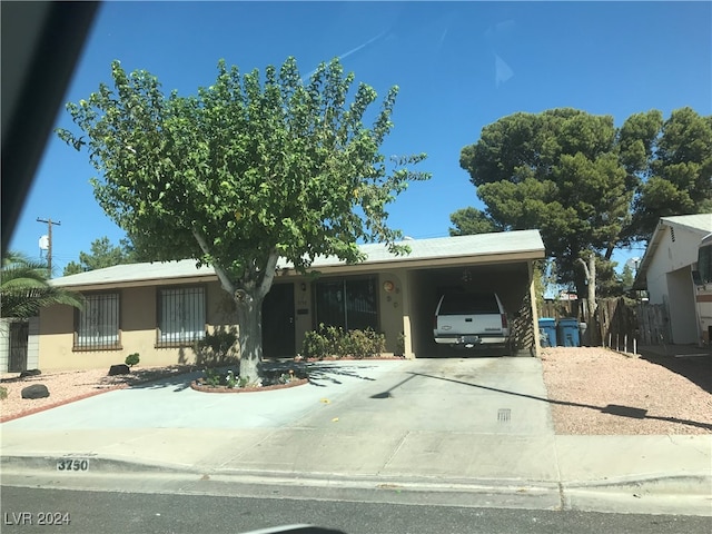 ranch-style house with a carport