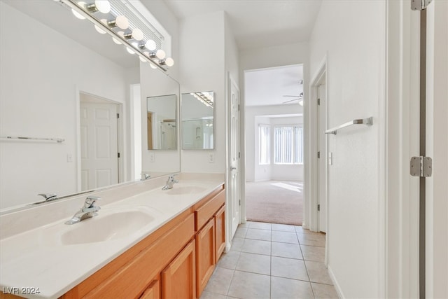 bathroom with tile patterned flooring, vanity, and ceiling fan