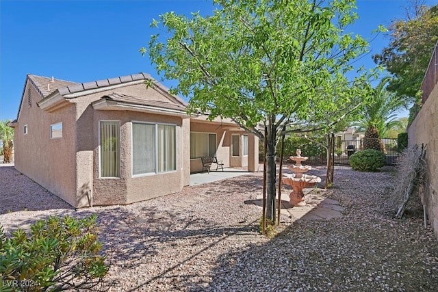 rear view of house with a patio