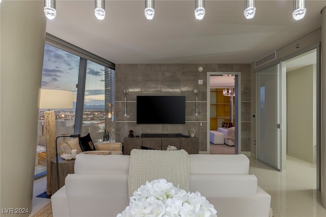 living room featuring floor to ceiling windows