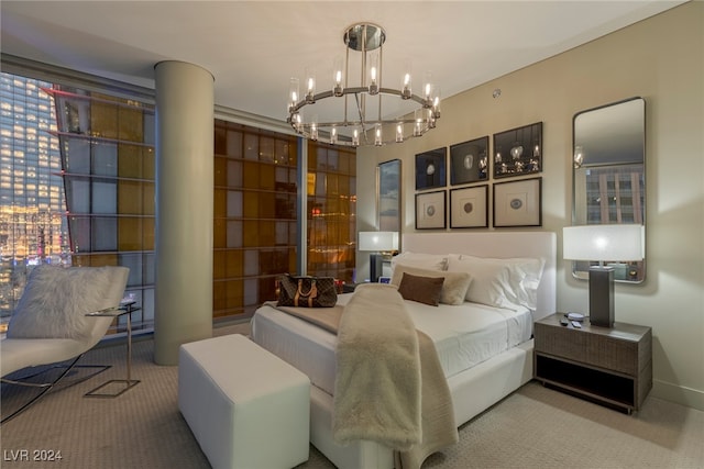 carpeted bedroom featuring a notable chandelier