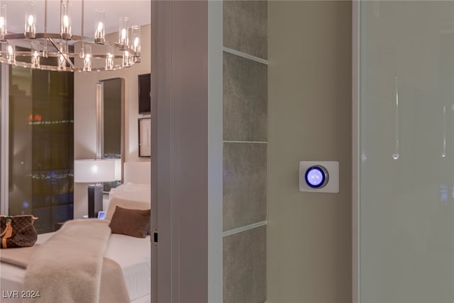 bathroom featuring an inviting chandelier