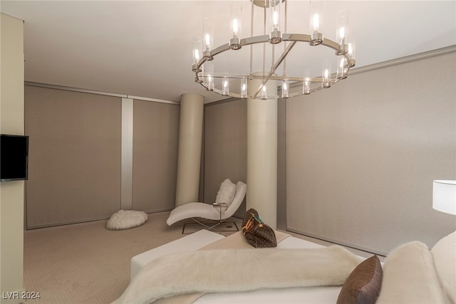 bedroom featuring carpet flooring and a chandelier