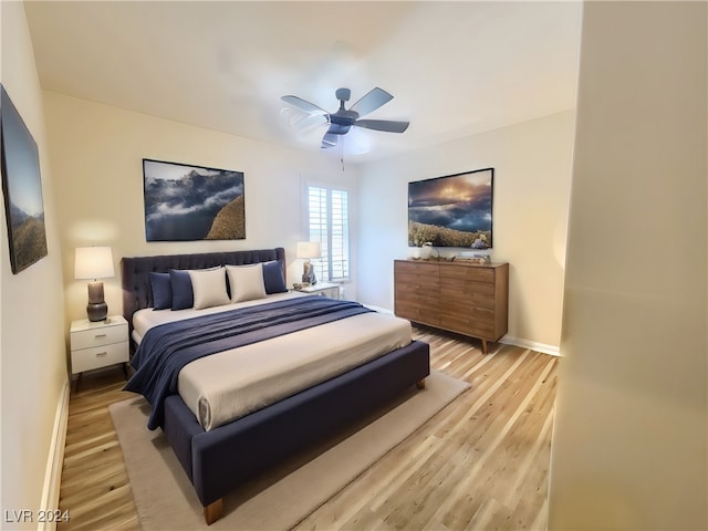 bedroom featuring light hardwood / wood-style floors and ceiling fan