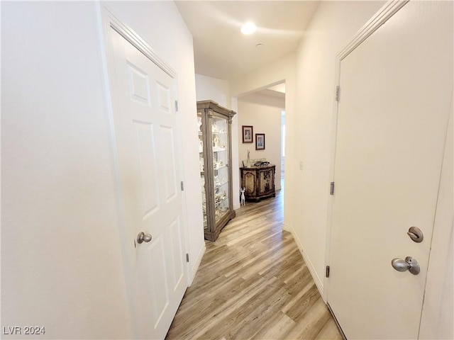 1152 Bear Head St, Henderson, NV 89011 - corridor featuring baseboards and light wood-style floors