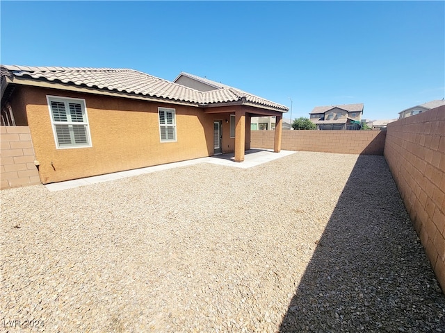 rear view of property with a patio area