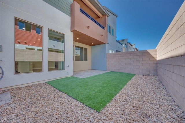 view of yard featuring a patio and a fenced backyard