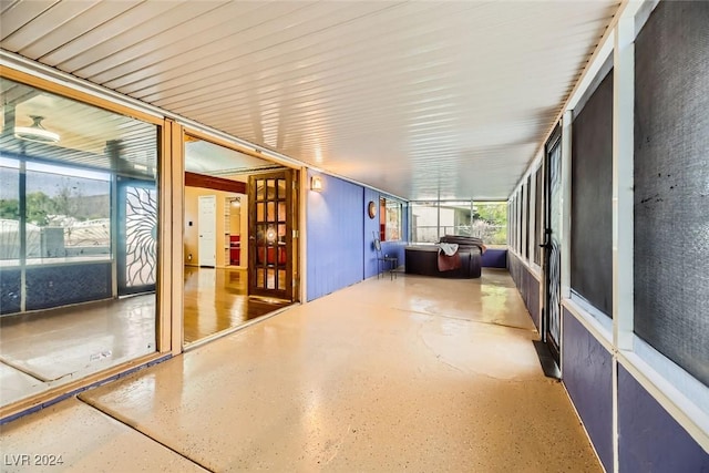 unfurnished sunroom with plenty of natural light