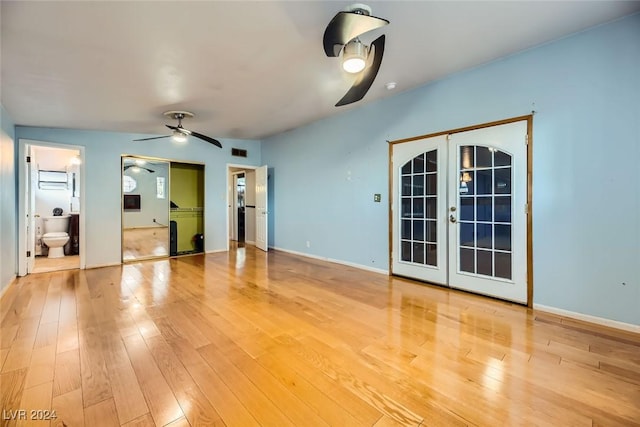 spare room featuring french doors, hardwood / wood-style flooring, and ceiling fan