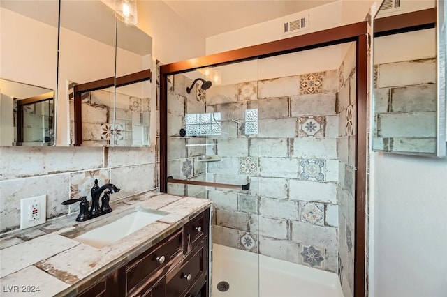 bathroom featuring backsplash, vanity, and walk in shower