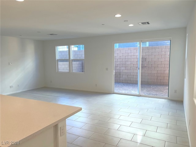 spare room with light tile patterned floors