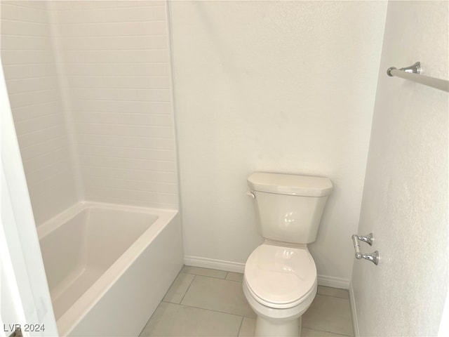 bathroom with tile patterned flooring and toilet