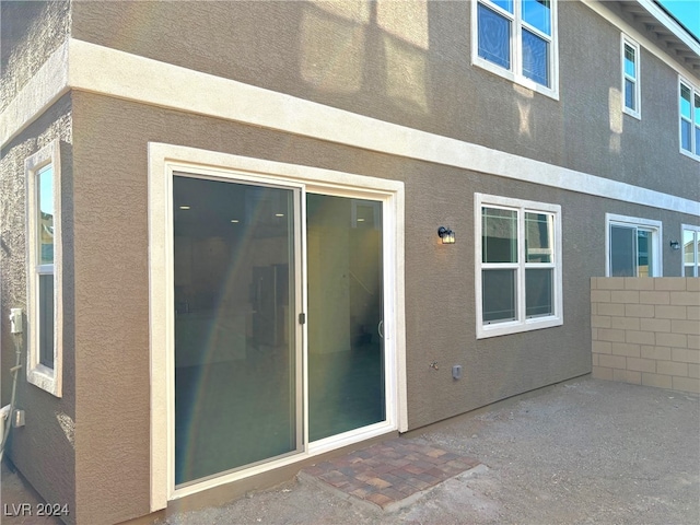 rear view of house with a patio