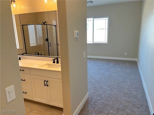 bathroom with vanity and an enclosed shower