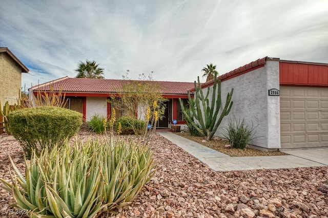 ranch-style home with a garage