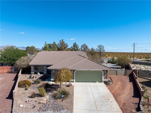 ranch-style home featuring a garage