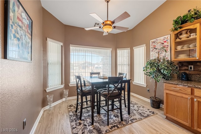 dining area with ceiling fan and light hardwood / wood-style flooring