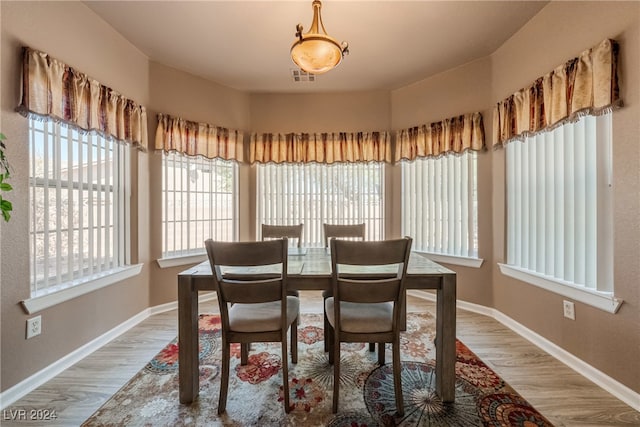 dining room with wood-type flooring