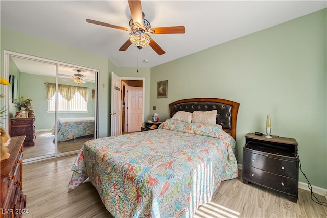 bedroom with a closet, ceiling fan, and hardwood / wood-style flooring