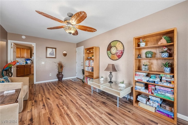 sitting room with light hardwood / wood-style flooring and ceiling fan