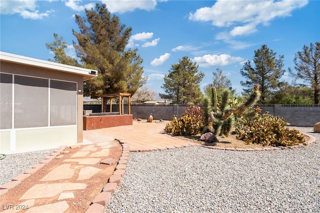 view of yard featuring a sunroom