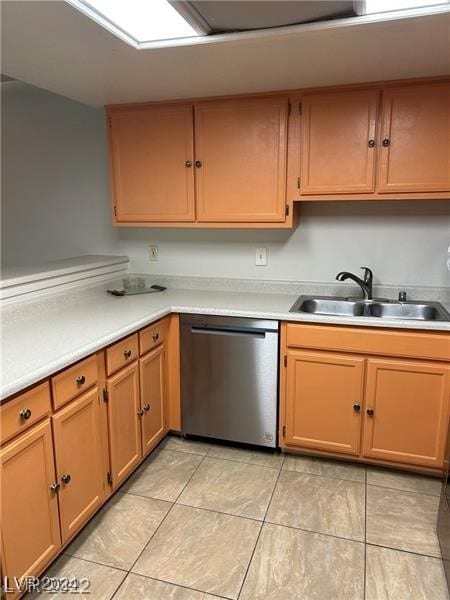 kitchen featuring sink, light tile patterned floors, and stainless steel dishwasher