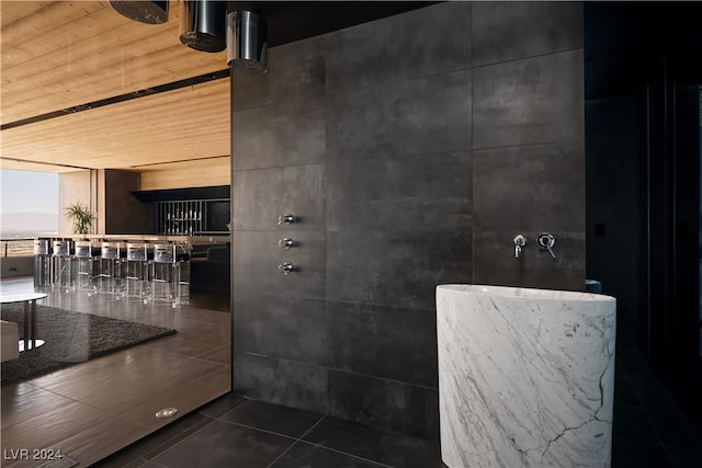 bathroom featuring wood ceiling, a shower, and tile patterned flooring