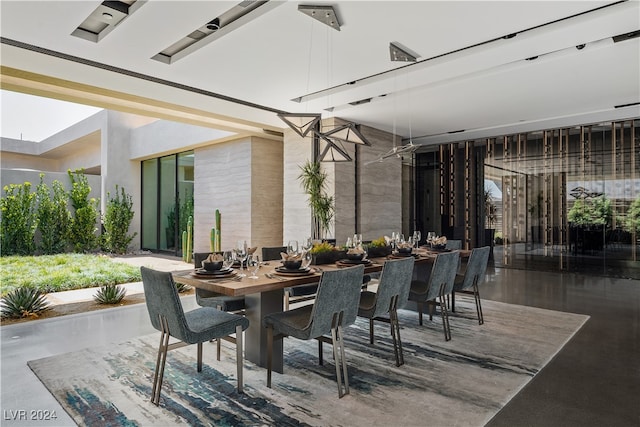 dining room with concrete flooring