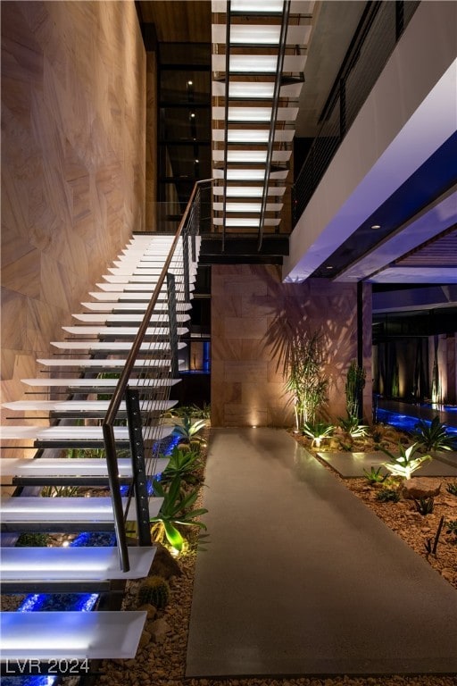 stairs with wood walls