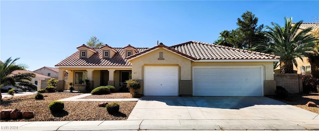 mediterranean / spanish-style home featuring a garage