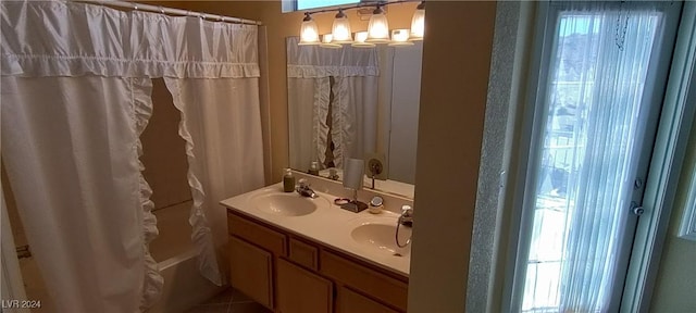 bathroom featuring shower / bath combination with curtain and vanity