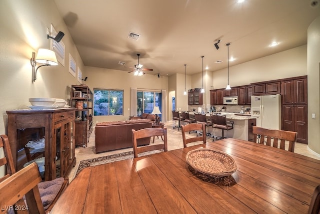 dining area featuring light hardwood / wood-style floors and ceiling fan