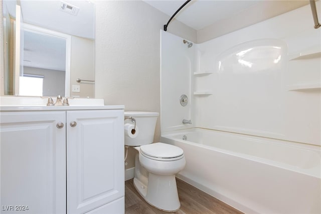 full bathroom featuring bathtub / shower combination, hardwood / wood-style flooring, vanity, and toilet