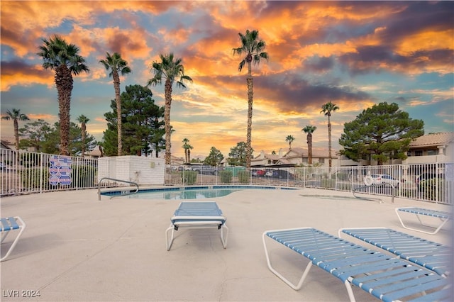 view of pool at dusk