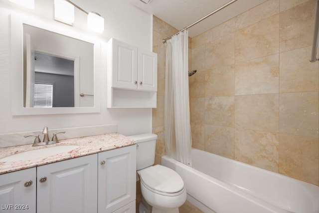 full bathroom with vanity, shower / bath combination with curtain, and toilet