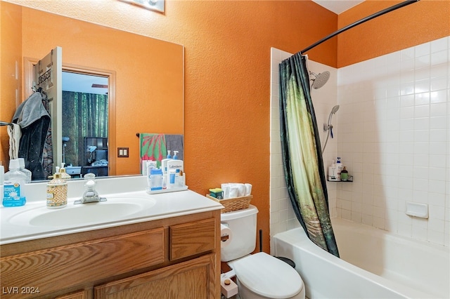 full bathroom with shower / tub combo with curtain, vanity, and toilet