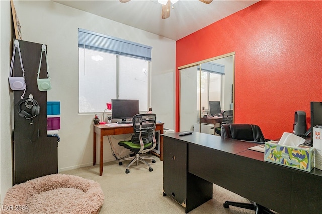 carpeted home office with ceiling fan