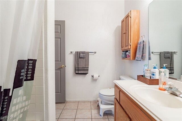 bathroom featuring a shower with curtain, tile patterned flooring, vanity, and toilet