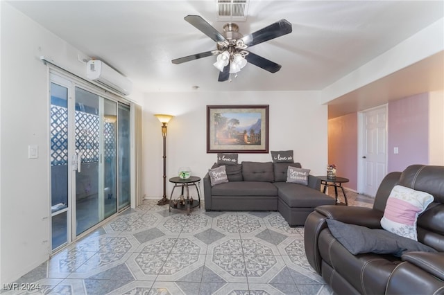 living room with ceiling fan and a wall mounted AC