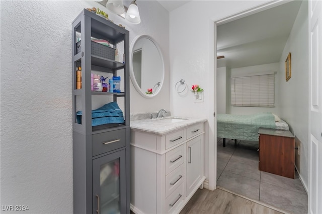 bathroom featuring vanity and hardwood / wood-style floors