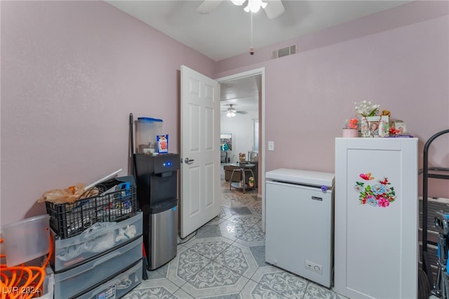 interior space featuring ceiling fan and light tile patterned floors