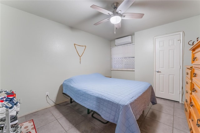 tiled bedroom featuring an AC wall unit and ceiling fan