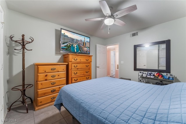 bedroom with light tile patterned floors and ceiling fan