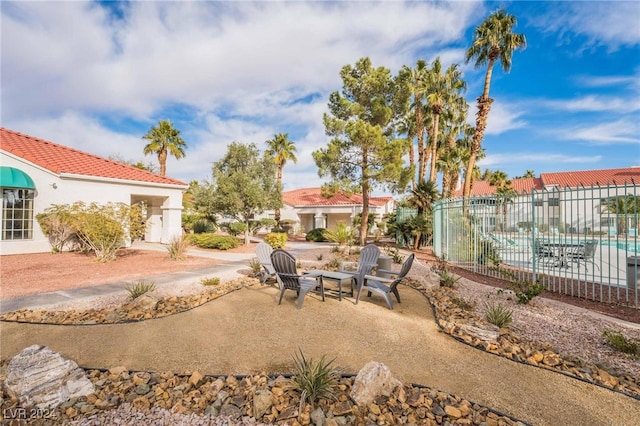 view of yard with a fenced in pool and a patio